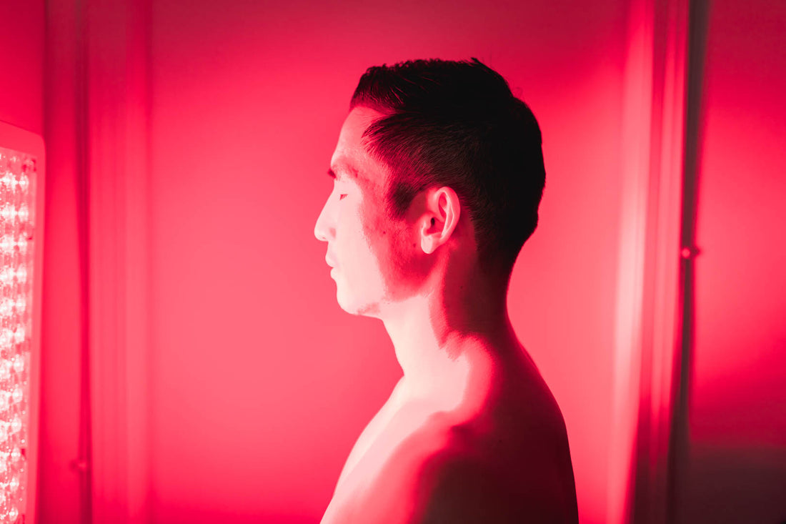 Man Standing In Front Of Orion Red Light Therapy Orion 500. Reduce SAD with Red Light Therapy